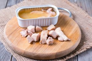 Liver of cod on a wooden board